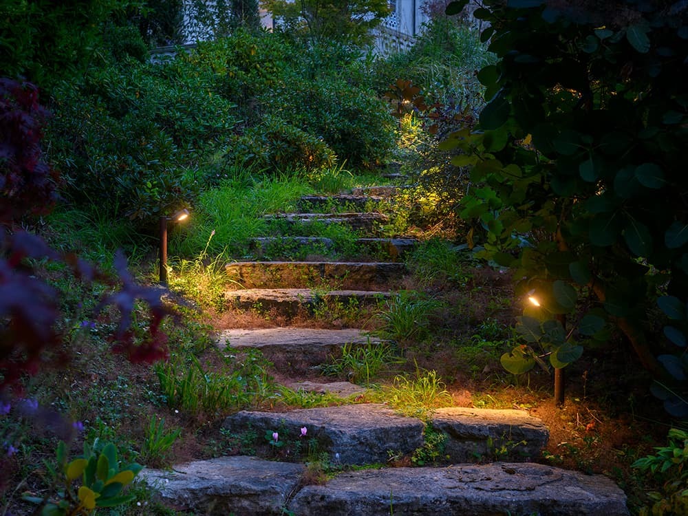 Close-up of Hunza copper outdoor fitting — installed and maintained by Moonlight Design