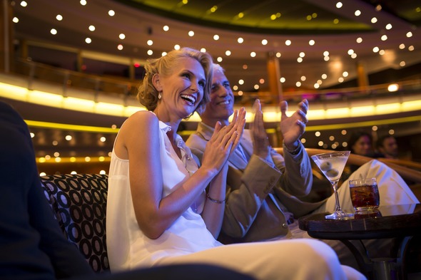 Guests in the theatre on Regent Seven Seas Voyager