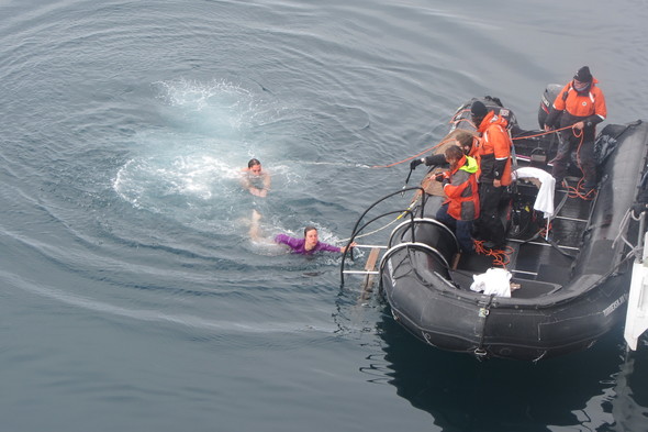 Alex taking the polar plunge in Antarctica