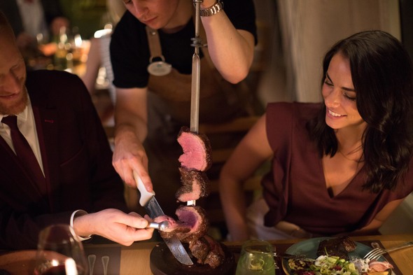 Couple dining in Churrascaria restaurant on Crystal Symphony