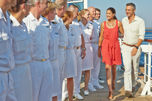 Seabourn crew welcoming guests on board