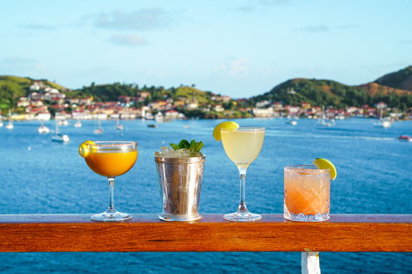 Enjoying cocktails on a Seabourn cruise in the Caribbean, a destination that features in our 2022 cruise trends