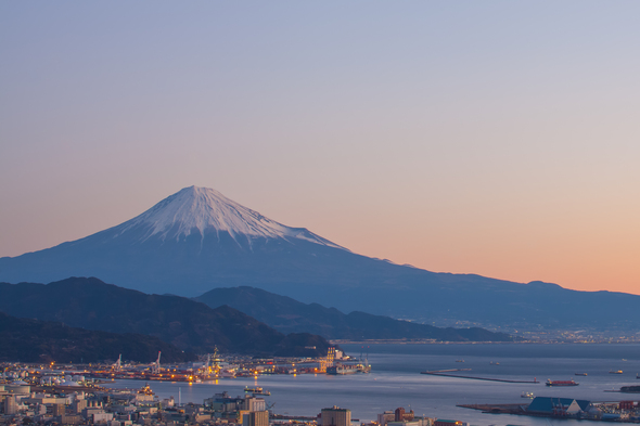 Snow capped Mount Fuji overlooking the unique port Shimizu, Japan