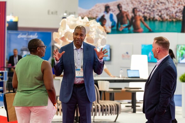 Exhibitor speaking to guests at Seatrade Cruise Global in Miami 2022