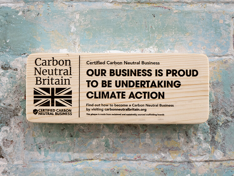 Wooden plaque showing our Carbon Neutral Britain certification.