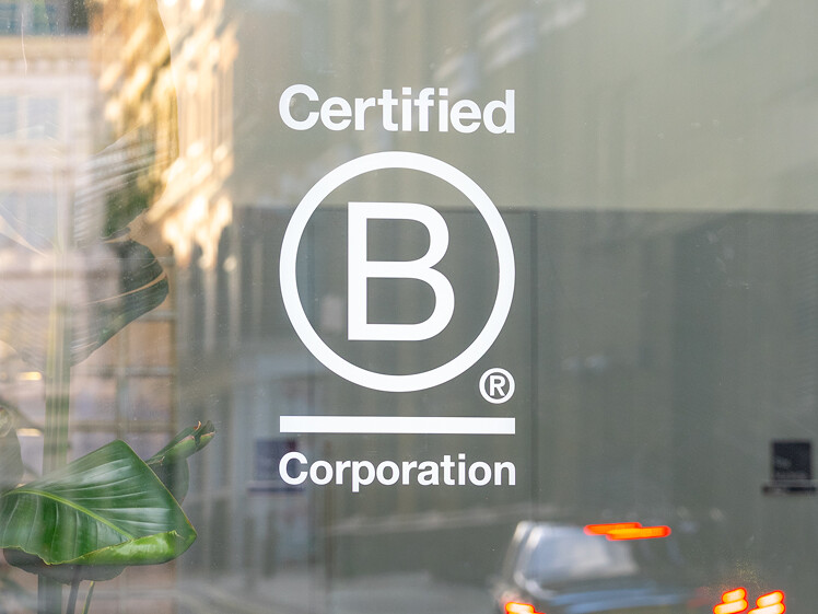 B-Corp certification logo on our glass window at our office.