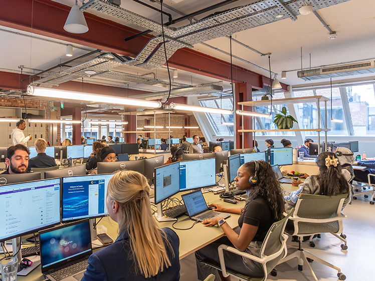 1st Formations staff members on call to customers facing the camera and smiling.