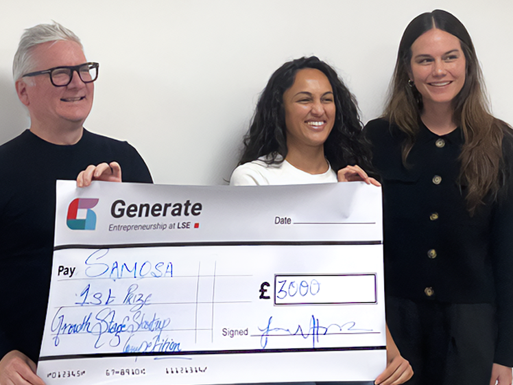 Graeme holding a cheque for LSE.