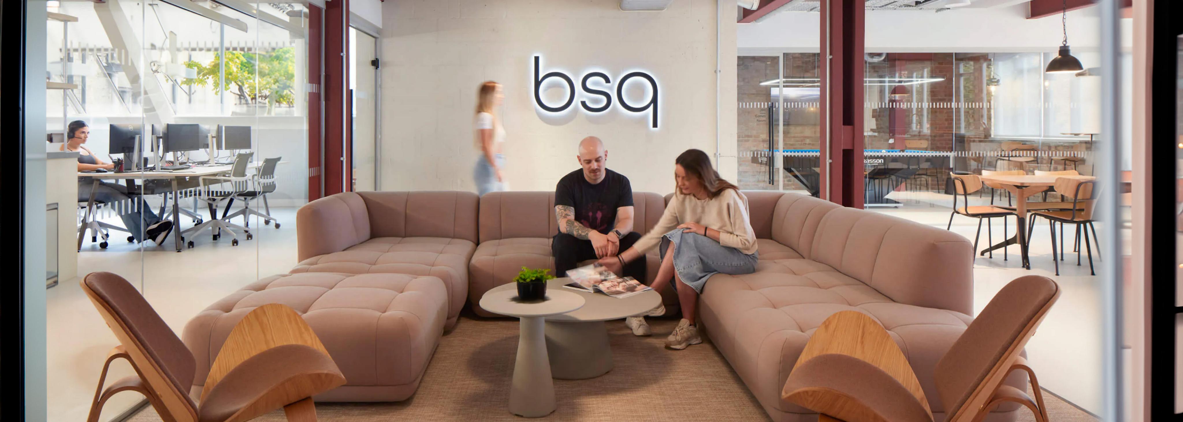 Colleagues relaxing on a sofa in our bsq Covent Garden office.