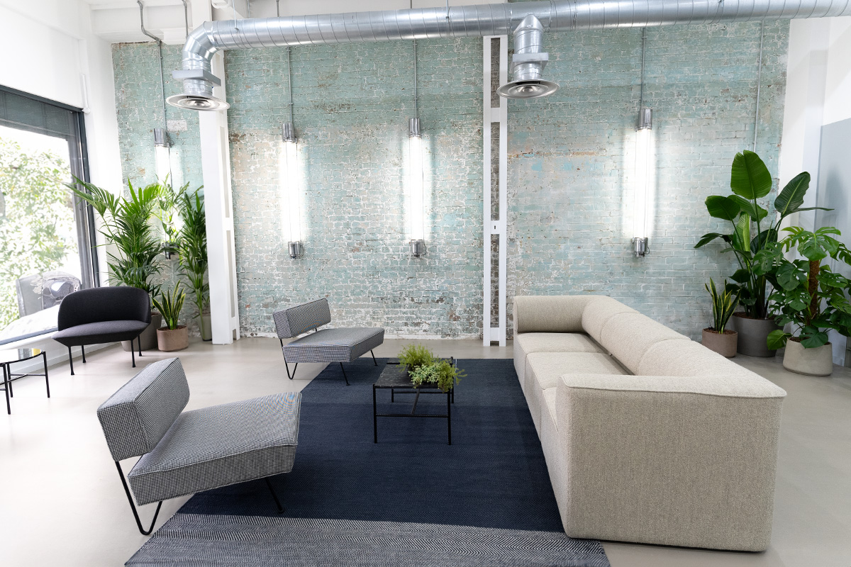 Our office lounge area with recycled materials and energy-efficient lighting.