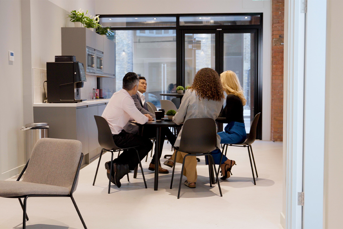 Colleagues meeting in our energy-conscious office space.