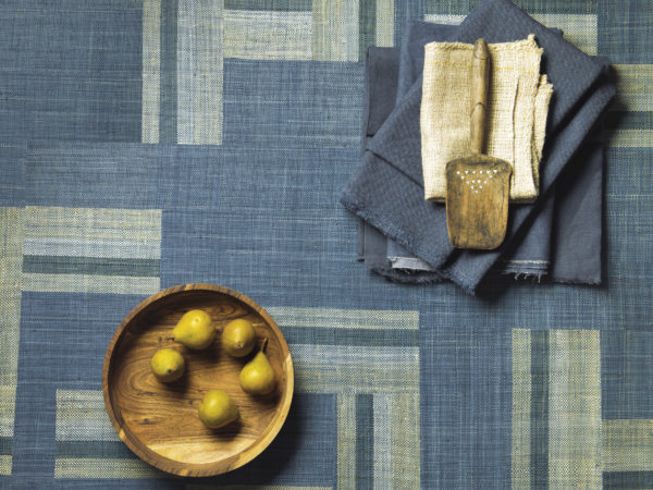 Handwoven raffia squares form a striking blue and beige patchwork in Boro style, reflecting Omexco's love and passion for authentic craftsmanship.