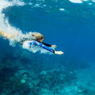 girl diving into water