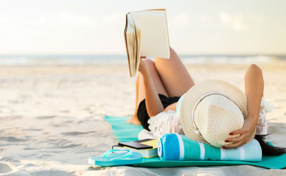 Reading a book on the beach