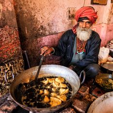 Indian man cooking in the street in Rajasthan
