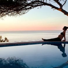 pregnant woman pool sunrise