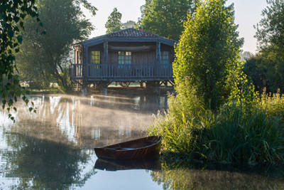 exterior of the hotel and view of the lake in front