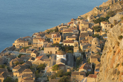 Aerial view of the Peloponnese coast line and rooftops of buildings