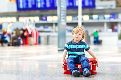 a small boy at an airport