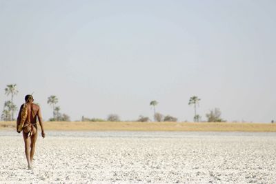 a bushman walking