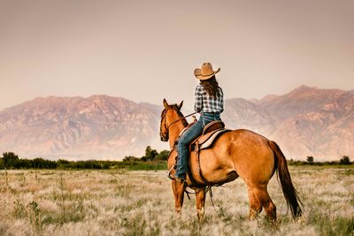 cowgirl looking at the horizon