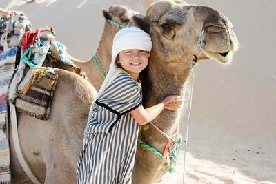 Camel with child in Jordan
