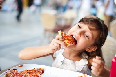 Child Eating Pizza