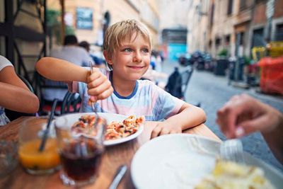 Concierge Boy Eating Pizza