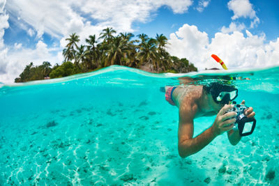 man snorkelling maldives