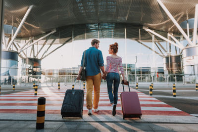 Couple at airport with bags