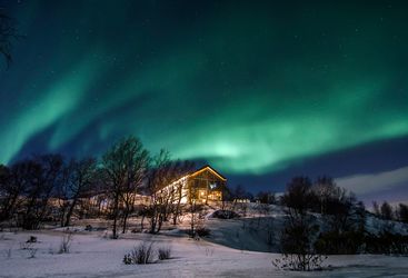 The Northern Lights over Kirkenes Snowhotel
