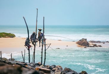 fishermen-on-stilts-in-ocean