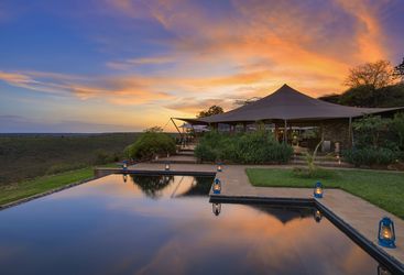Infinity pool at Louisaba tented camp during sunset