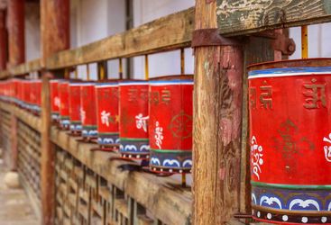 Red prayer wheels, Bhutan