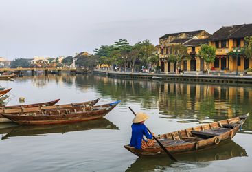 Vietnamese woman on boat in Hoi An