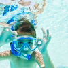 Boy snorkelling on family holiday