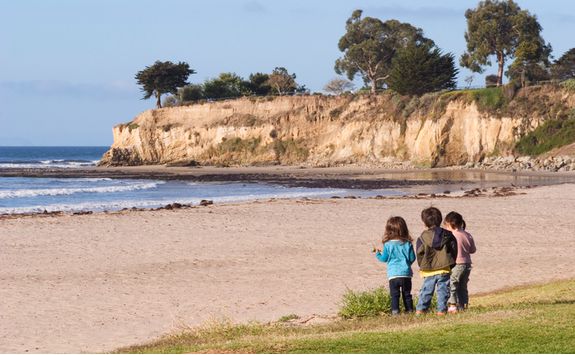 children exploring santa barbara beach