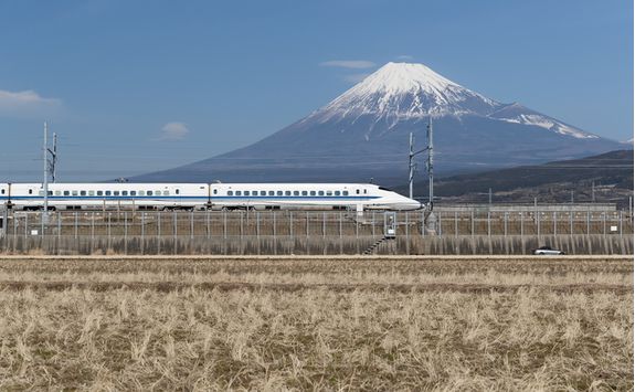 Bullet train travelling past Mount Fuji