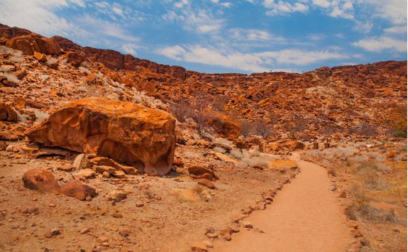 A desert road going through the twyfelfonteim landscape