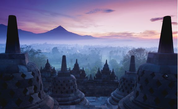 Sunrise over the ancient Buddhist Stupa Borobudur