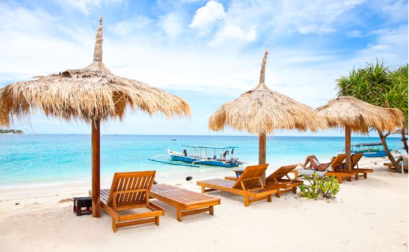 Sun loungers and umbrella on Lombok beach