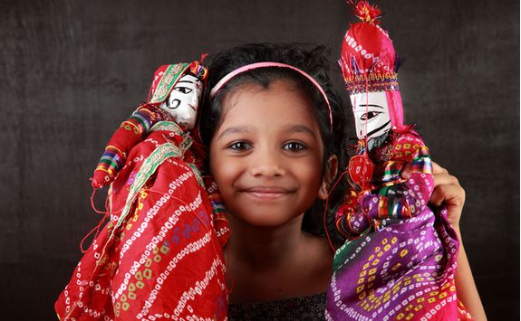 Udaipur girl with puppets