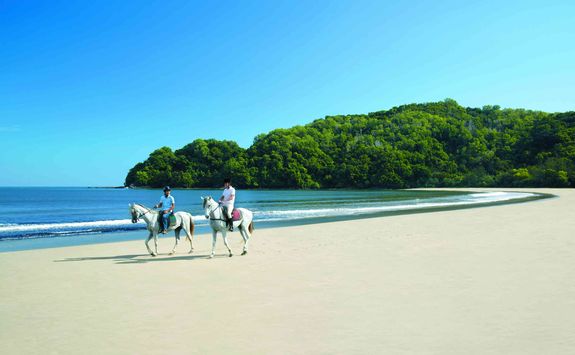 Riding on the beach at the Shangri-La Rasa Ria