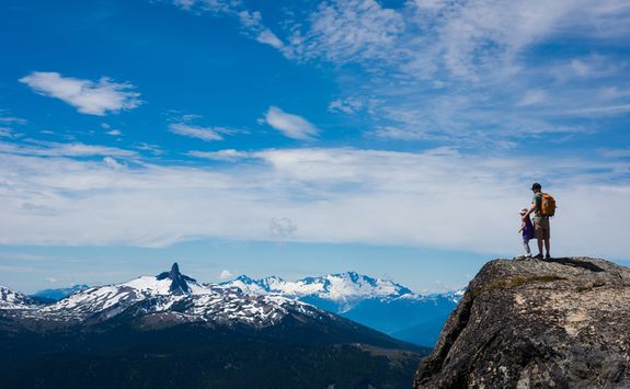 Father and daughter enjoying the mountain view