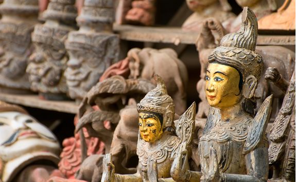 Carved wooden statutes