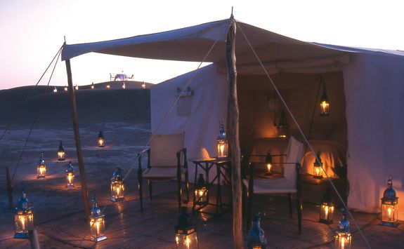 Dar Ahlam tent at night with candles
