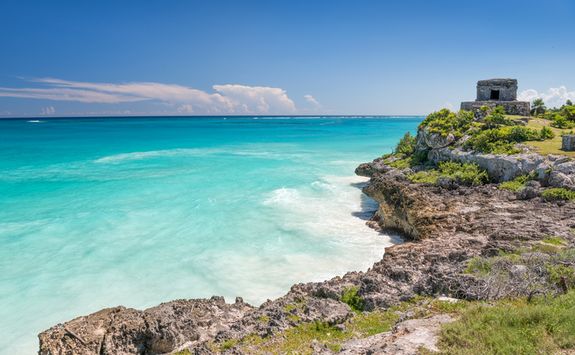 tropical beach with Tulum's ancient ruins