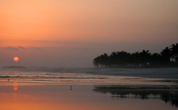 sunset on a beach in Salalah