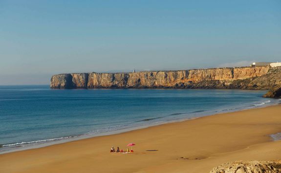 a family on a beach in the Algarve