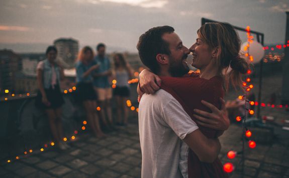 Couple at rooftop bar